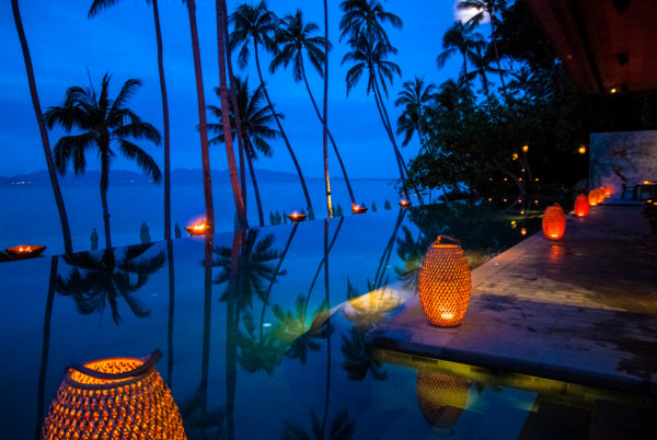 FSKS pool, twilight, palm trees, lanterns